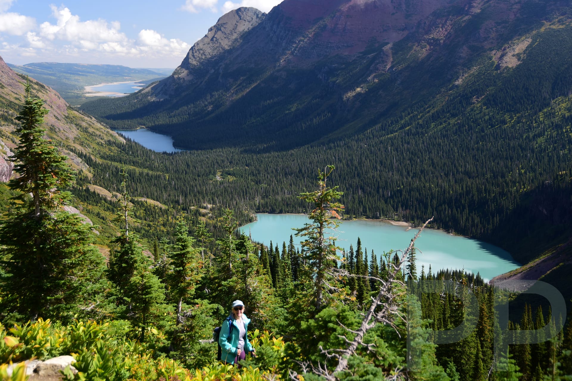 Alpine lake surrounded by steep mountain walls in the Many Glacier area of Glacier National Park