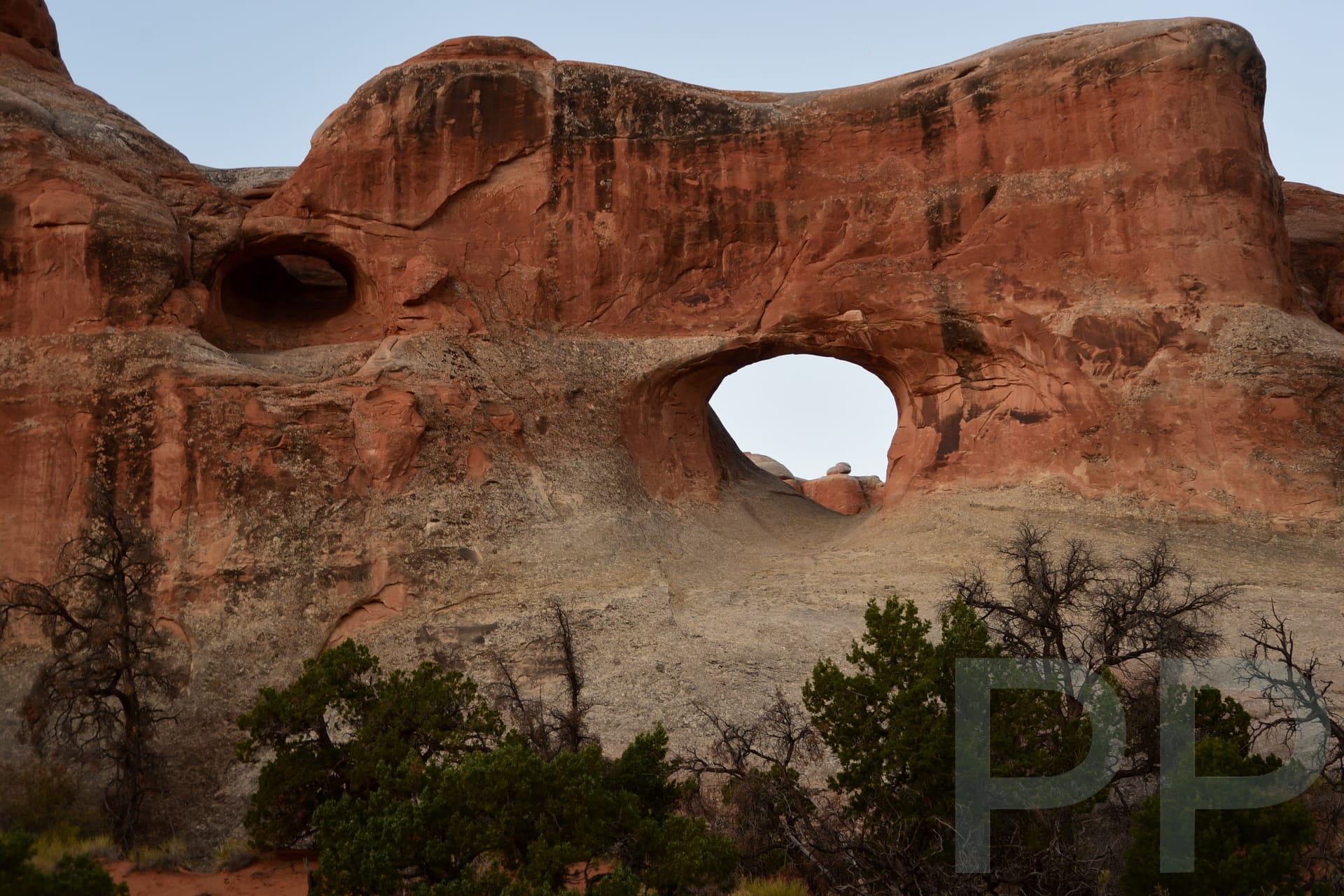 Tunnel Arch framed in sandstone fins at Devils Garden Arches National Park