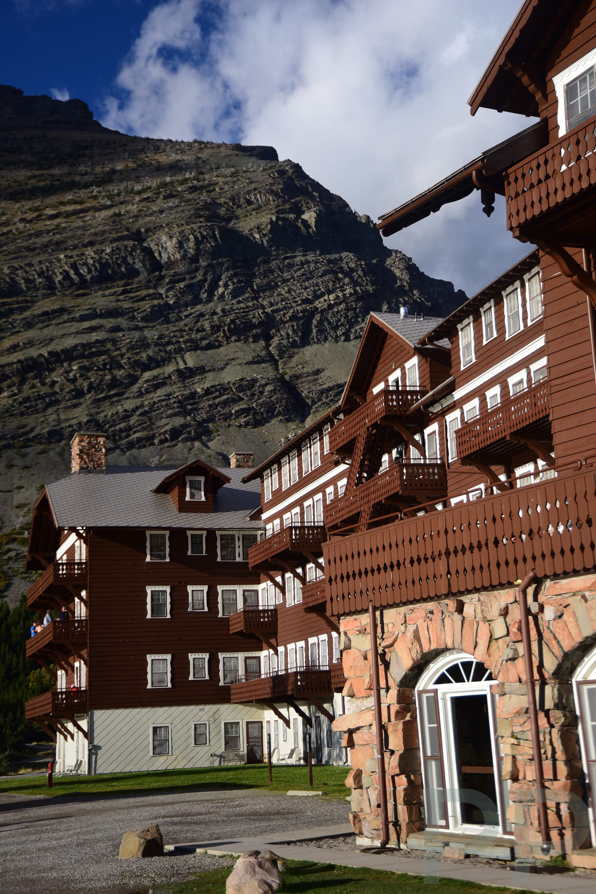 Back side of Many Glacier Hotel with balcony rooms facing Swiftcurrent Lake in Glacier National Park