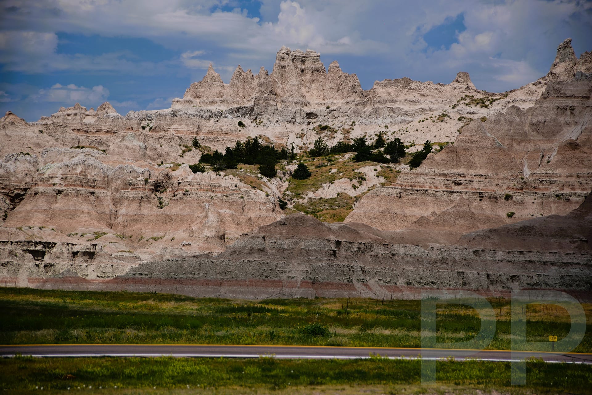 View of jagged Badlands rock formations and winding Badlands Loop Road from the Ben Reifel Visitor Center in South Dakota