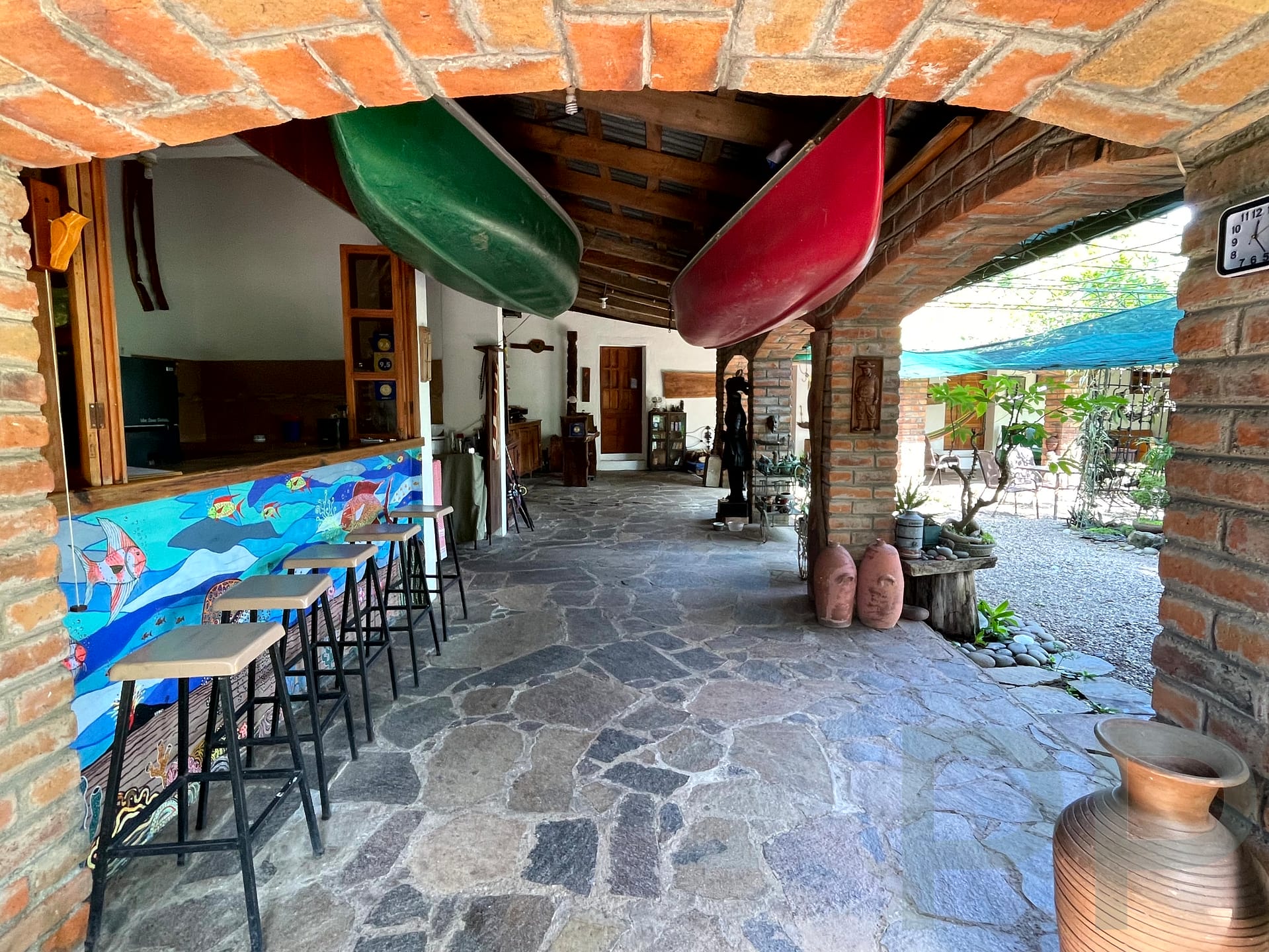 Covered patio and garden seating at the Mayan Grouper in Suchitoto overlooking Lake Suchitl&aacute;n