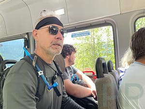 Hiker rides the Glacier Park Shuttle on the Going-to-the-Sun Road