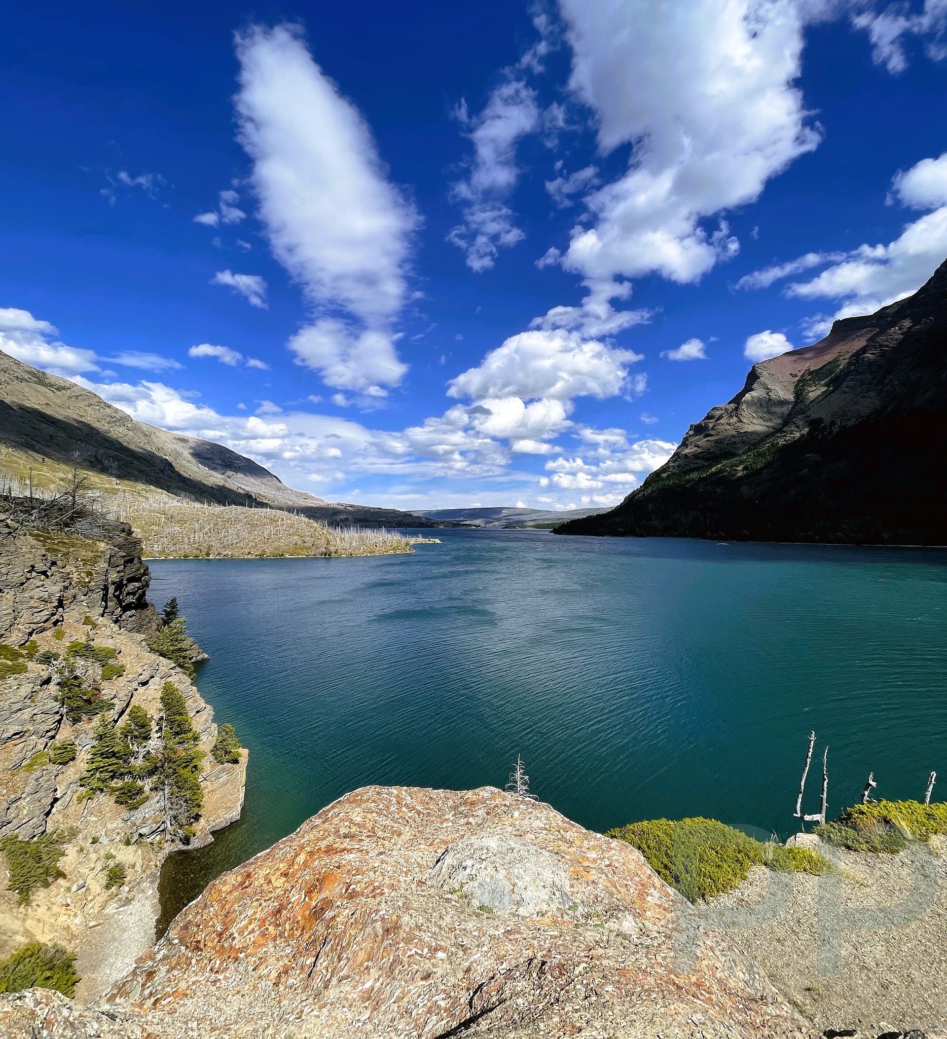 Wide view of St. Mary Lake with surrounding mountains in Glacier National Park, Montana