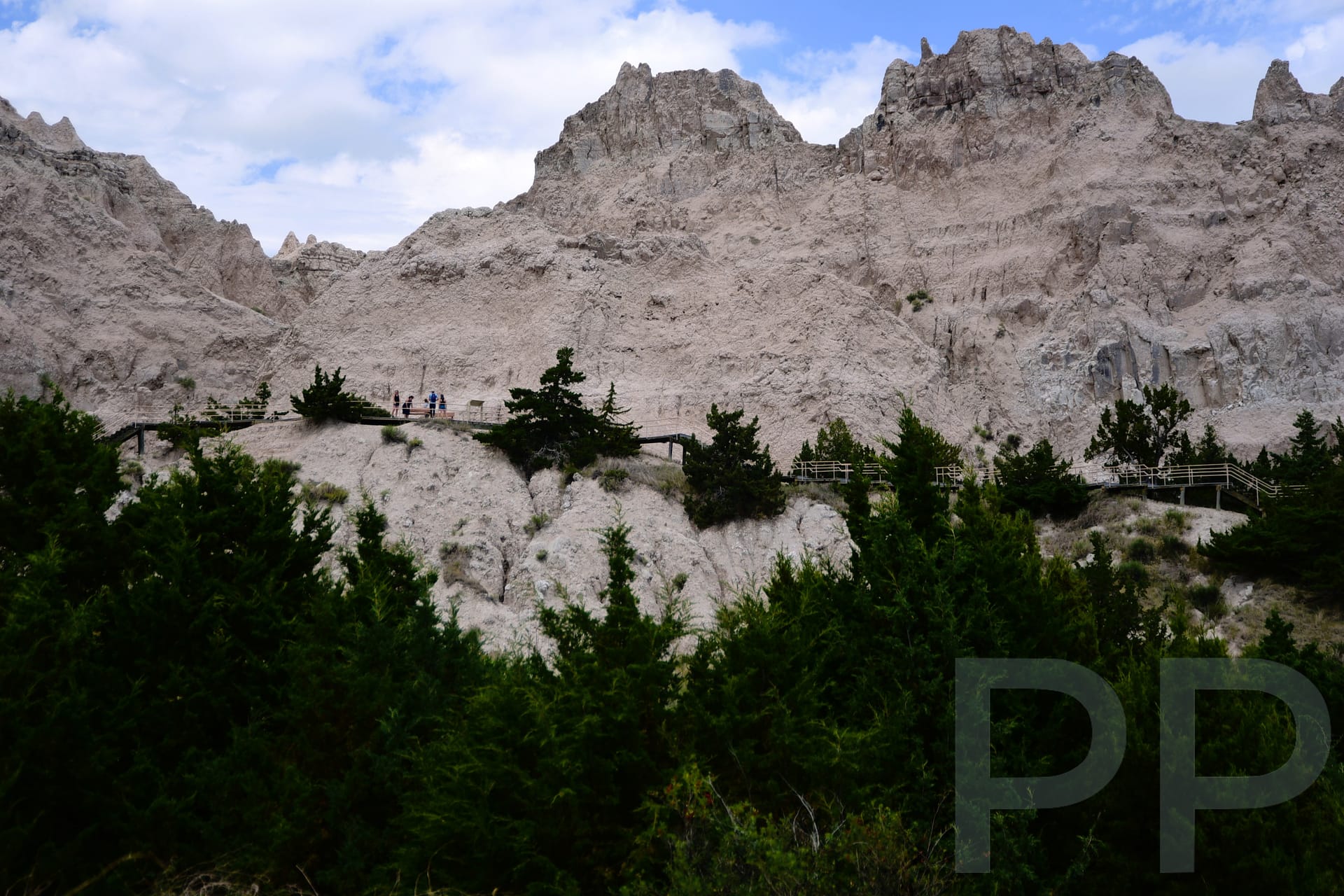 Wooden stairs climbing through rock formations on the Cliff Shelf Nature Trail