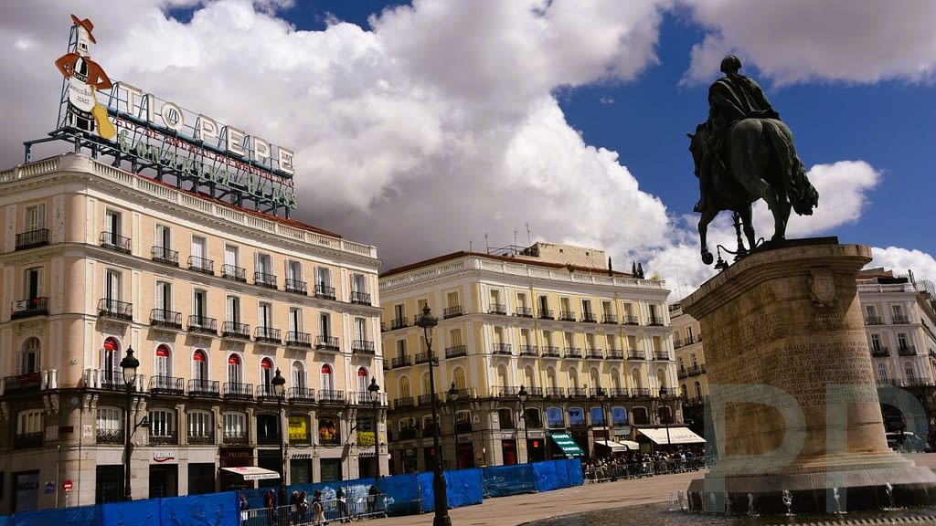 Puerta del Sol in Madrid with the Tío Pepe sign visible above the buildings.