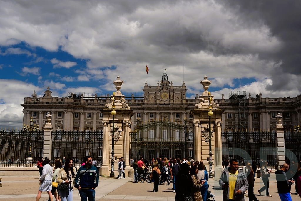 The Royal Palace of Madrid viewed from the outside with its long stone façade.