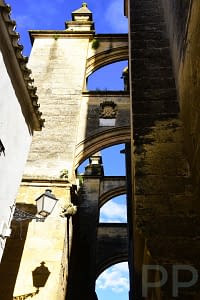 Narrow streets and stone archways in Arcos de la Frontera.