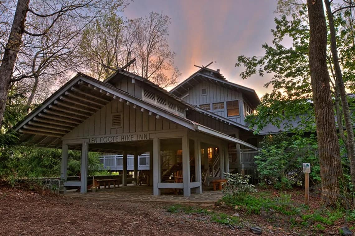Exterior view of the Len Foote Hike Inn lodge surrounded by forest near Amicalola Falls in North Georgia.