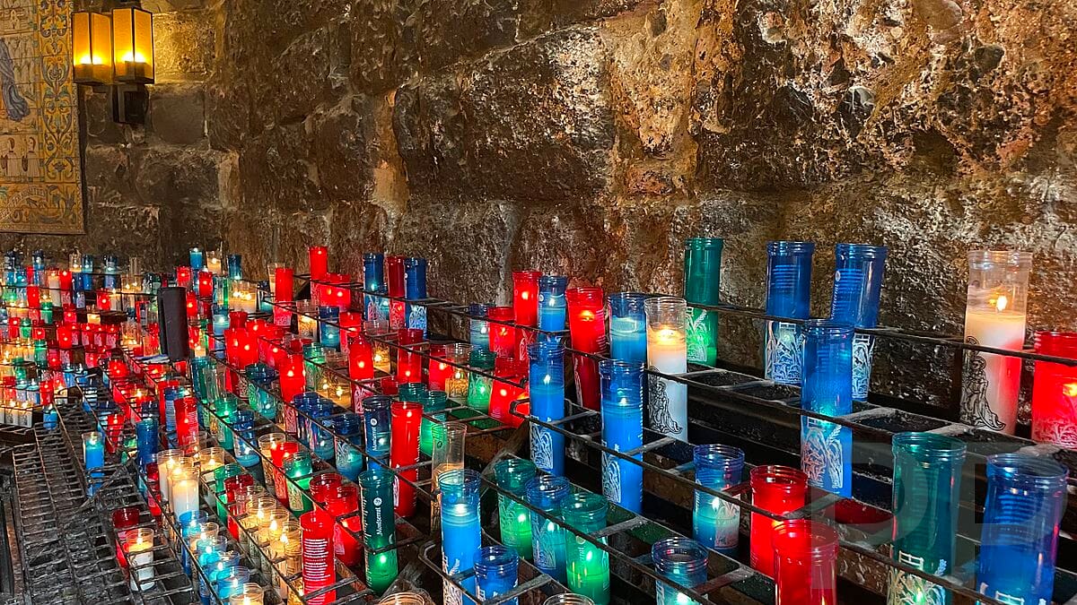 Hundreds of colorful votive candles line the hall just past the Black Madonna in the basilica at Montserrat.