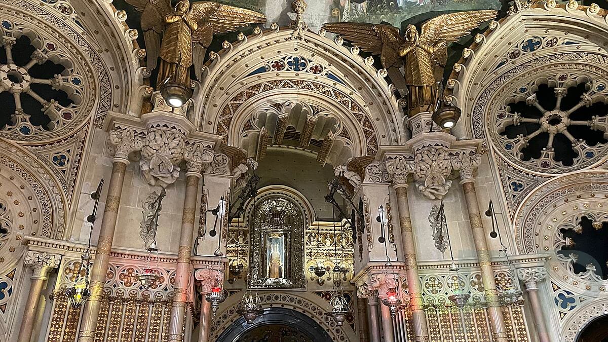 Ornate walls and religious artwork in the Sala del Cambril at Montserrat Abbey