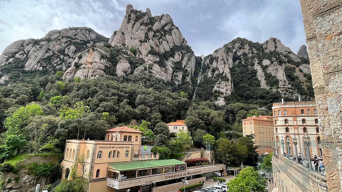 View from Montserrat Monastery down to the Cremallera station with towering rock formations in the background