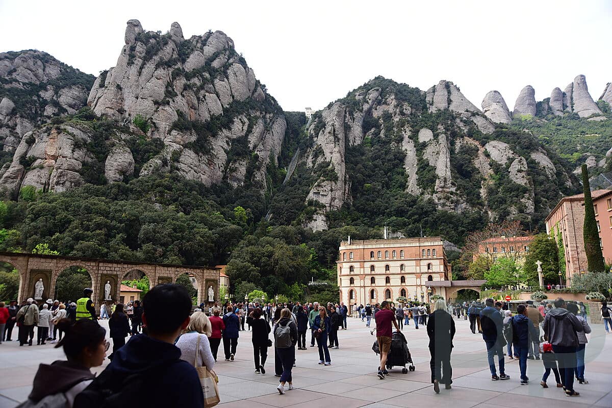 Crowds gathered in the main plaza at Montserrat Monastery in Spain
