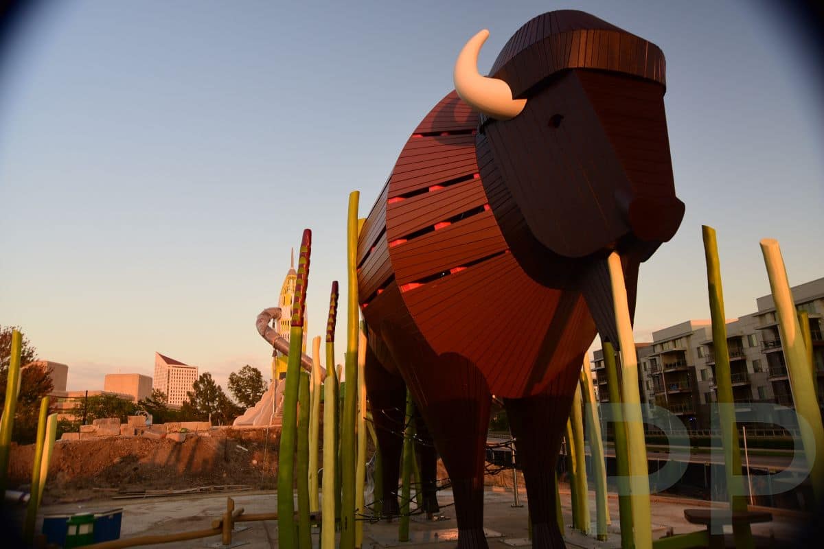 Giant bison-themed play structure under construction at the new outdoor playground at Exploration Place.