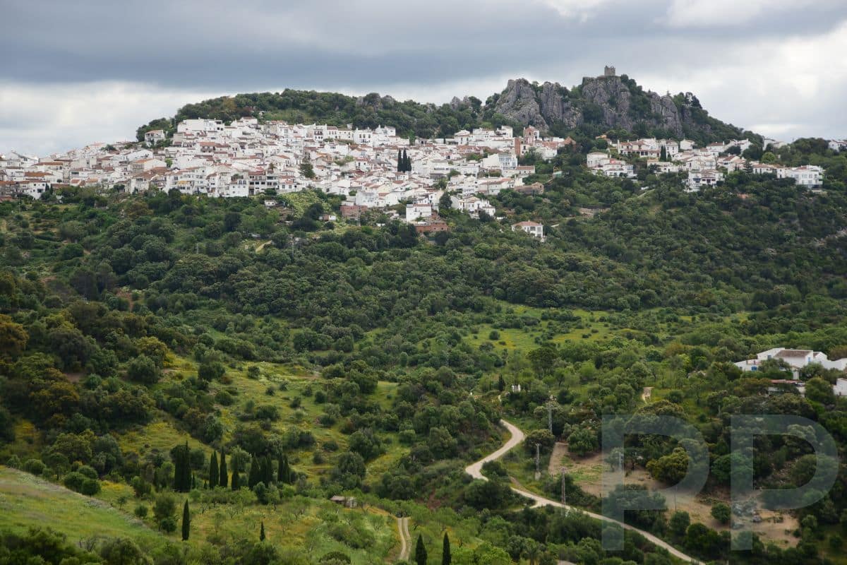 A white village perched high on a hill in Andalusia Spain.