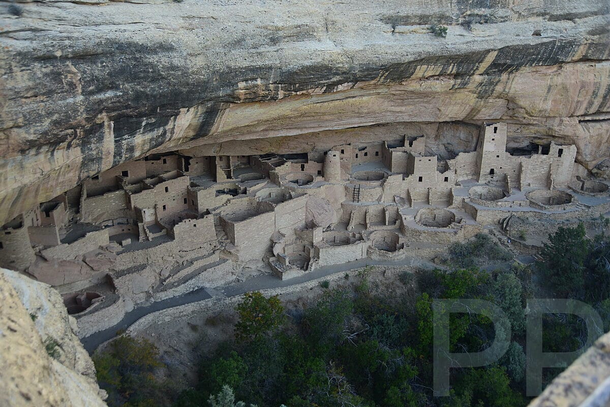 Cliff Palace cliff dwelling tucked beneath a sandstone alcove at Mesa Verde National Park.