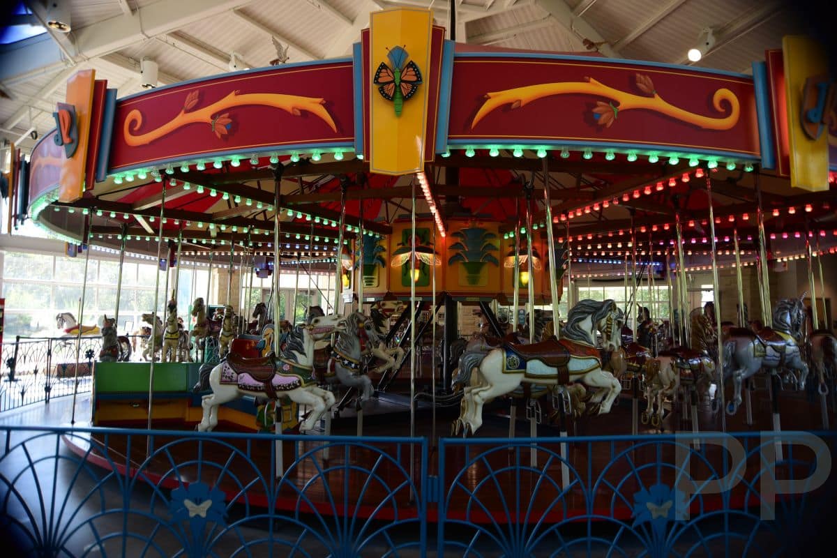 Historic carousel at Botanica Wichita with brightly painted horses and lights.
