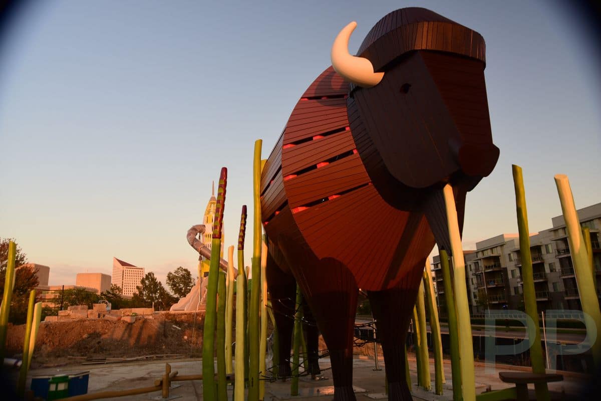 Giant bison-themed play structure under construction at the new outdoor playground at Exploration Place.