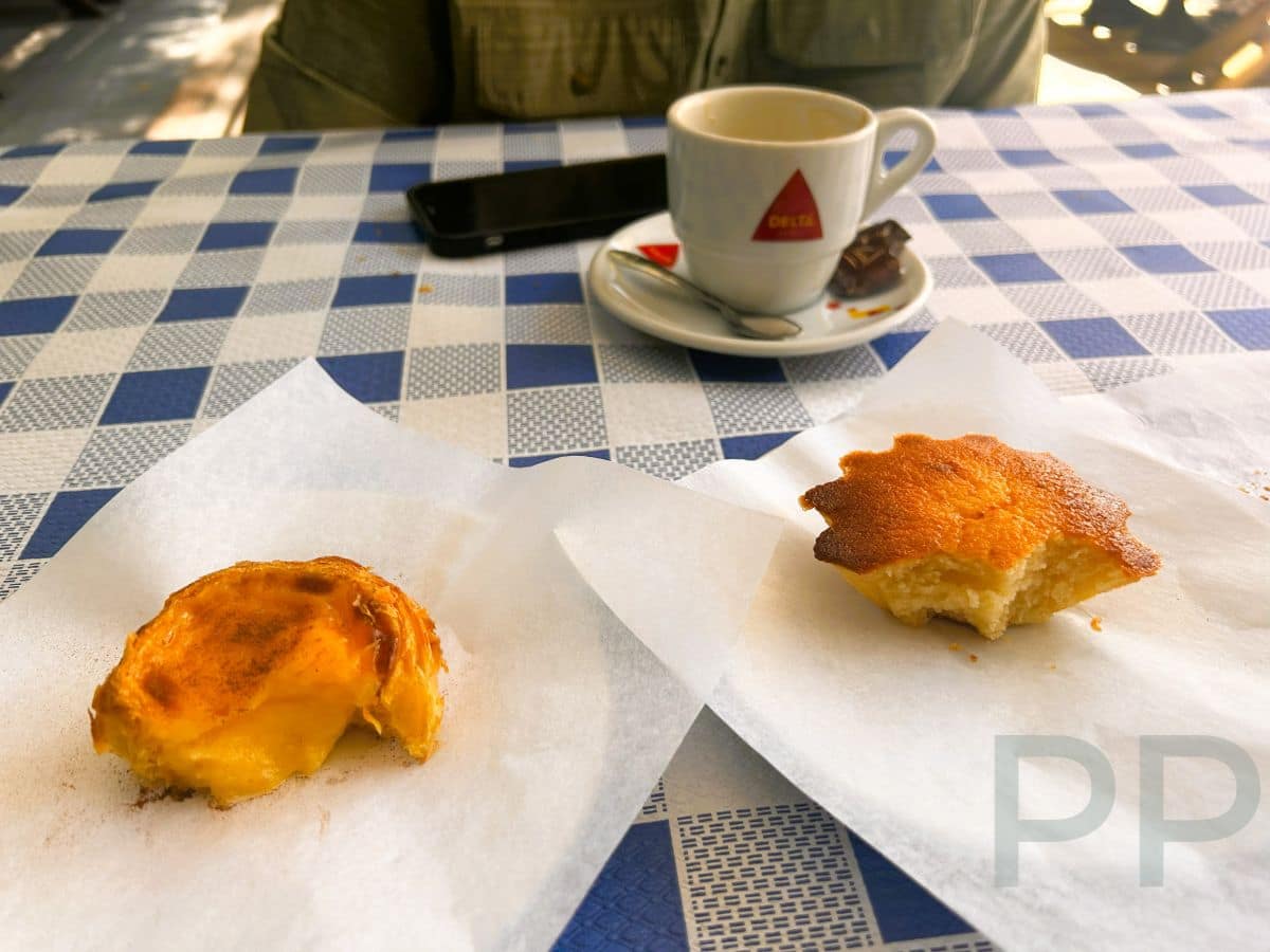Pastel de nata and P&atilde;o de Rala pastries on parchment paper with a cup of espresso at The Bakery Lounge in &Eacute;vora.
