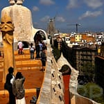 Gaudí’s Casa Milà with Sagrada Familia in the distance, Barcelona – highlight of any Spain itinerary