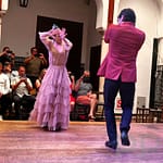 Flamenco dancers performing in Seville, Spain with traditional dress and expressive movement