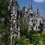 Quinta da Regaleira Palace and Gardens in Sintra, Portugal, with ornate architecture and lush greenery