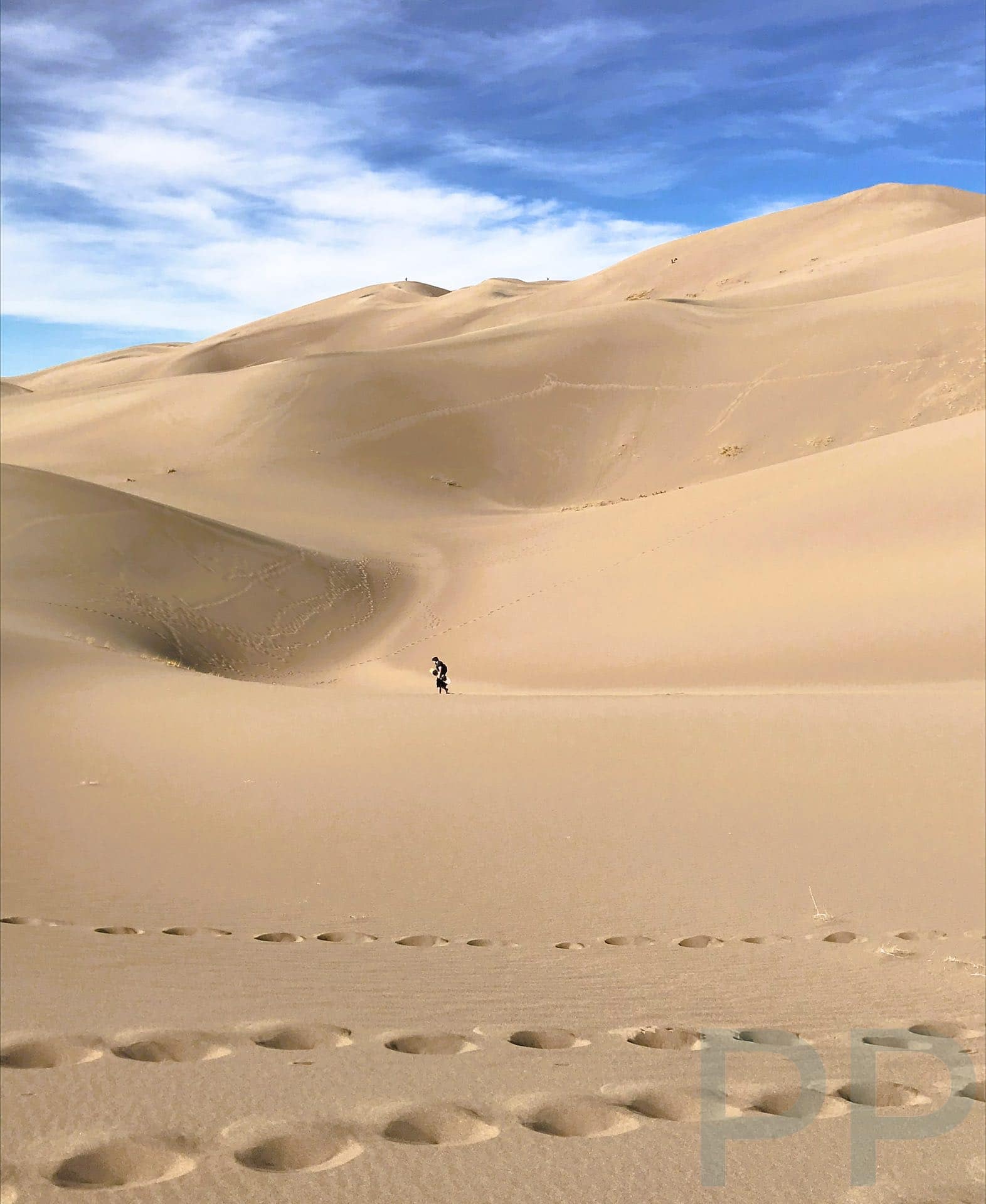 People Appear as Specks High on the Dunes in Great Sand Dunes National Park