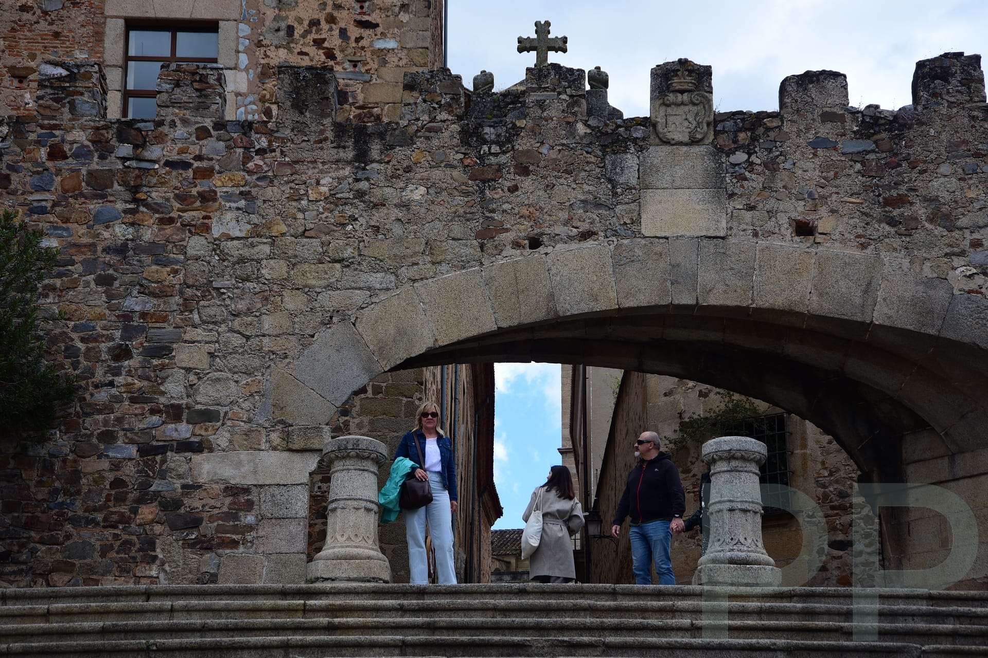 Historic Arco de la Estrella gate in Cáceres, Spain, marking the entrance to the medieval old town.