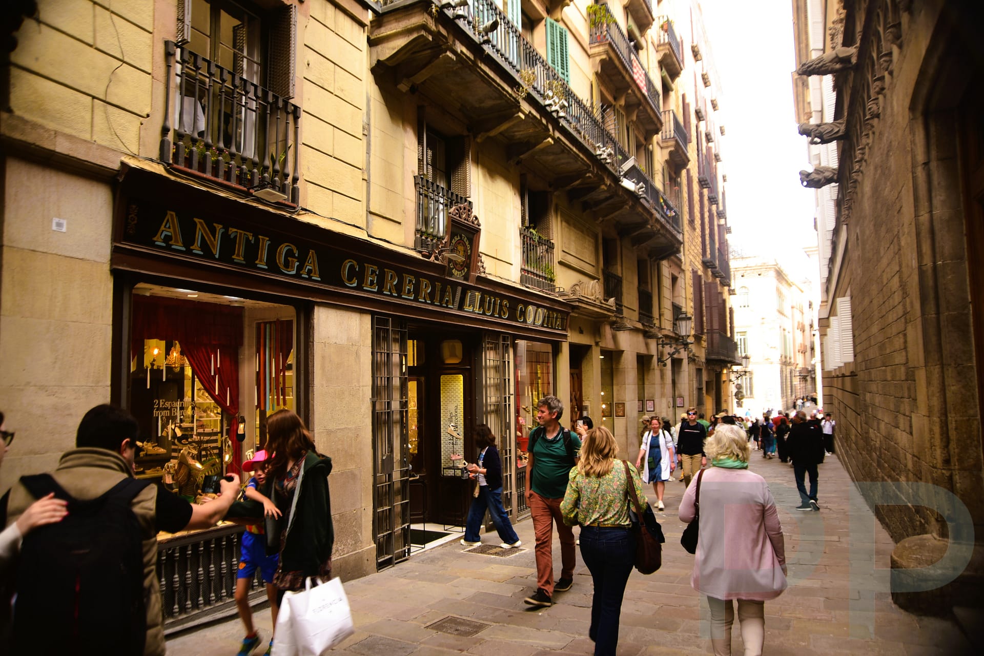 People strolling along a street in El Born neighborhood, Barcelona