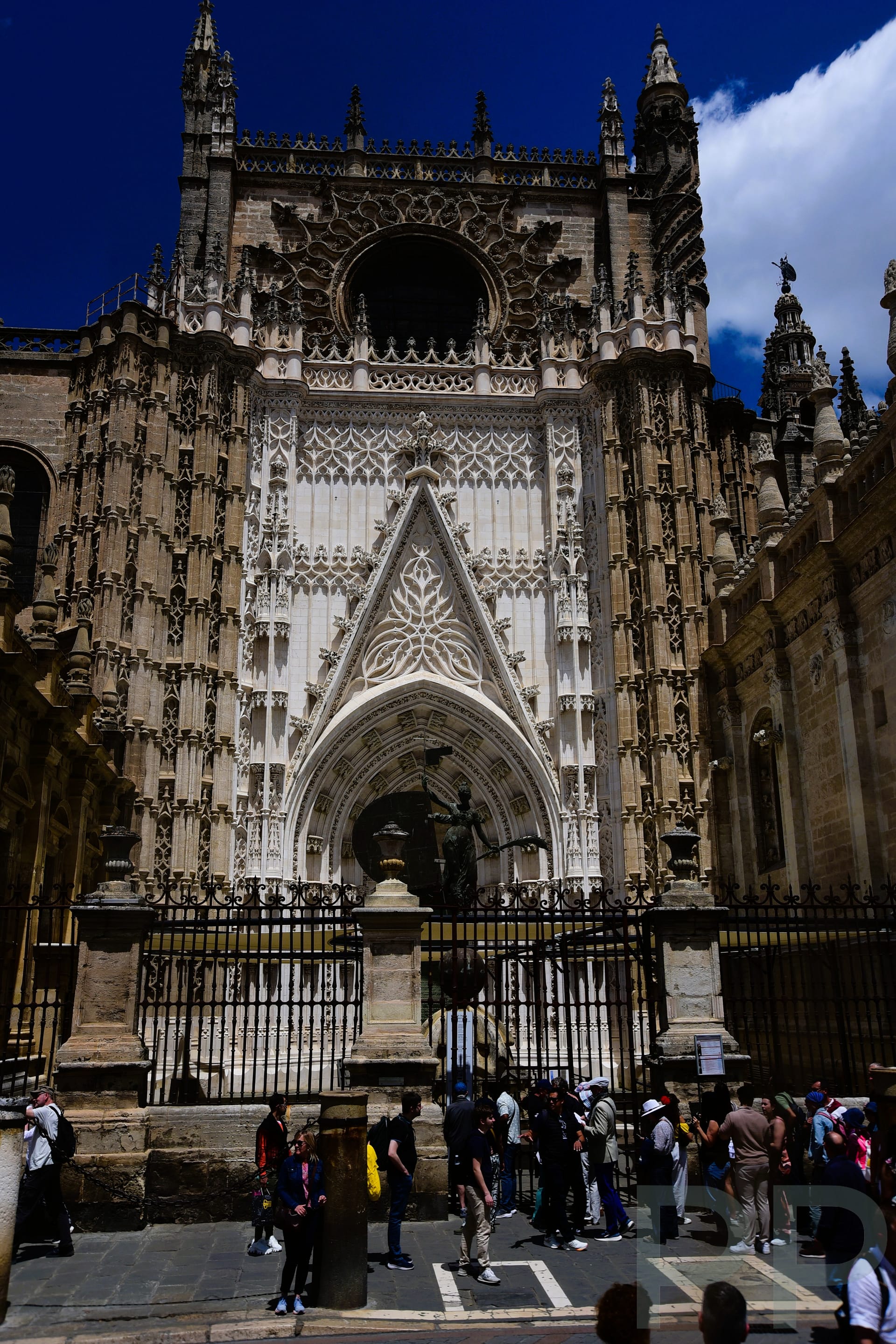 Detailed Gothic doorway of Seville Cathedral with carvings and stonework