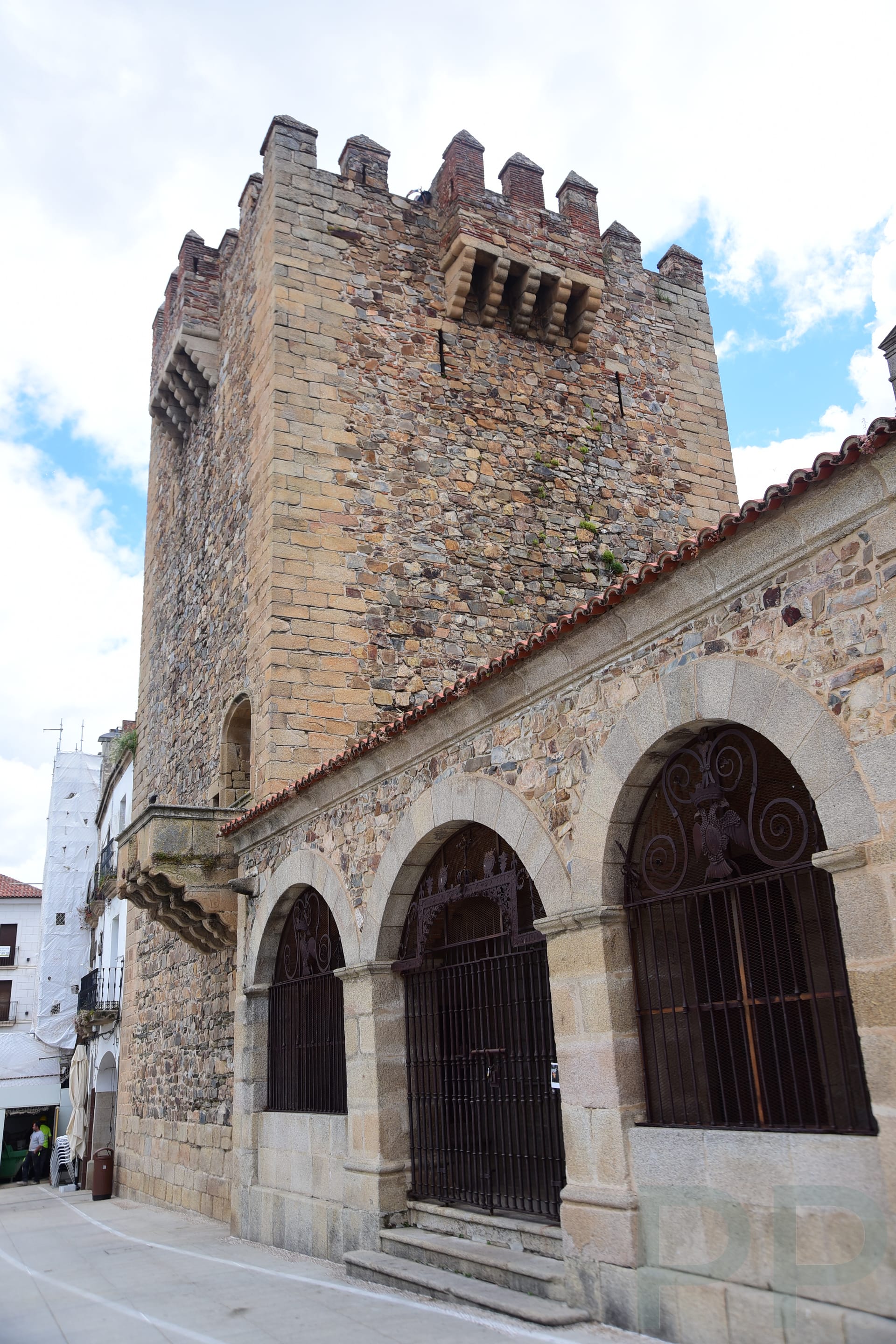 White Baroque façade and twin bell towers of Iglesia de San Francisco Javier in Cáceres, Spain.
