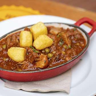 Carcamusas pork-and-tomato stew served at Cervecer&iacute;a El Tr&eacute;bol in Toledo