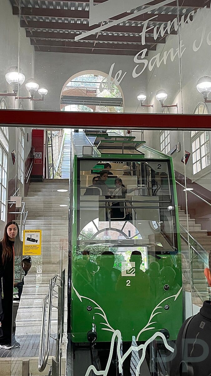 Interior of the Sant Joan Funicular station with the funicular car at Montserrat