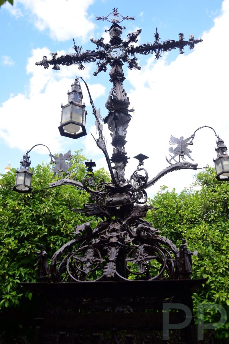 Plaza de Santa Cruz with trees, benches, and central cross monument