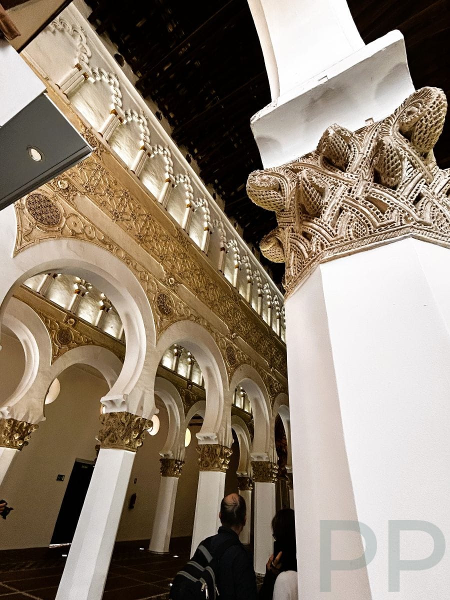 Interior of Santa Mar&iacute;a la Blanca synagogue with white horseshoe arches