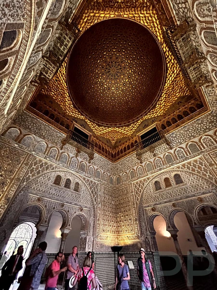 Courtyard in the Royal Alc&aacute;zar of Seville with arches and tilework