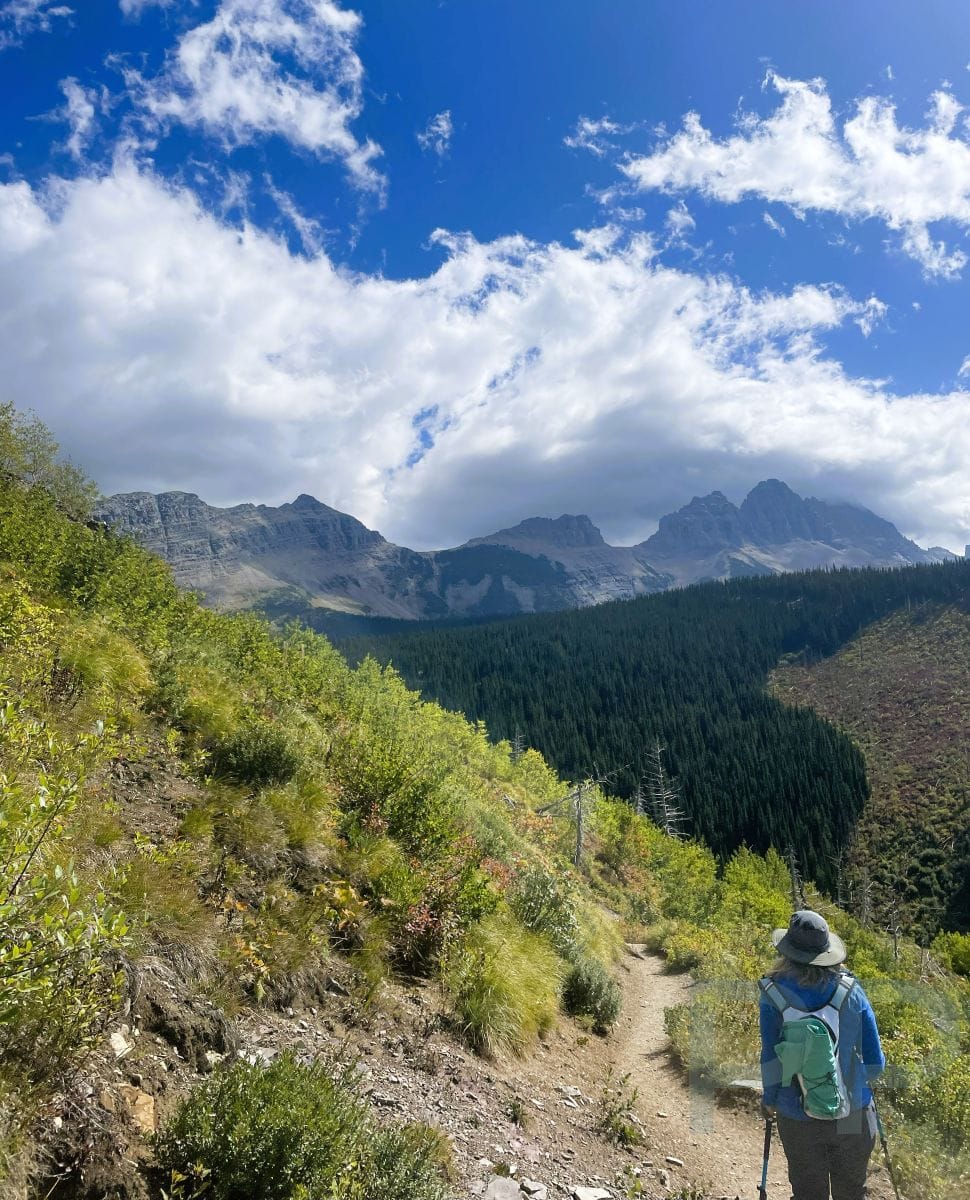 Hiker descending the Loop Trail toward The Loop on the Going-to-the-Sun Road.