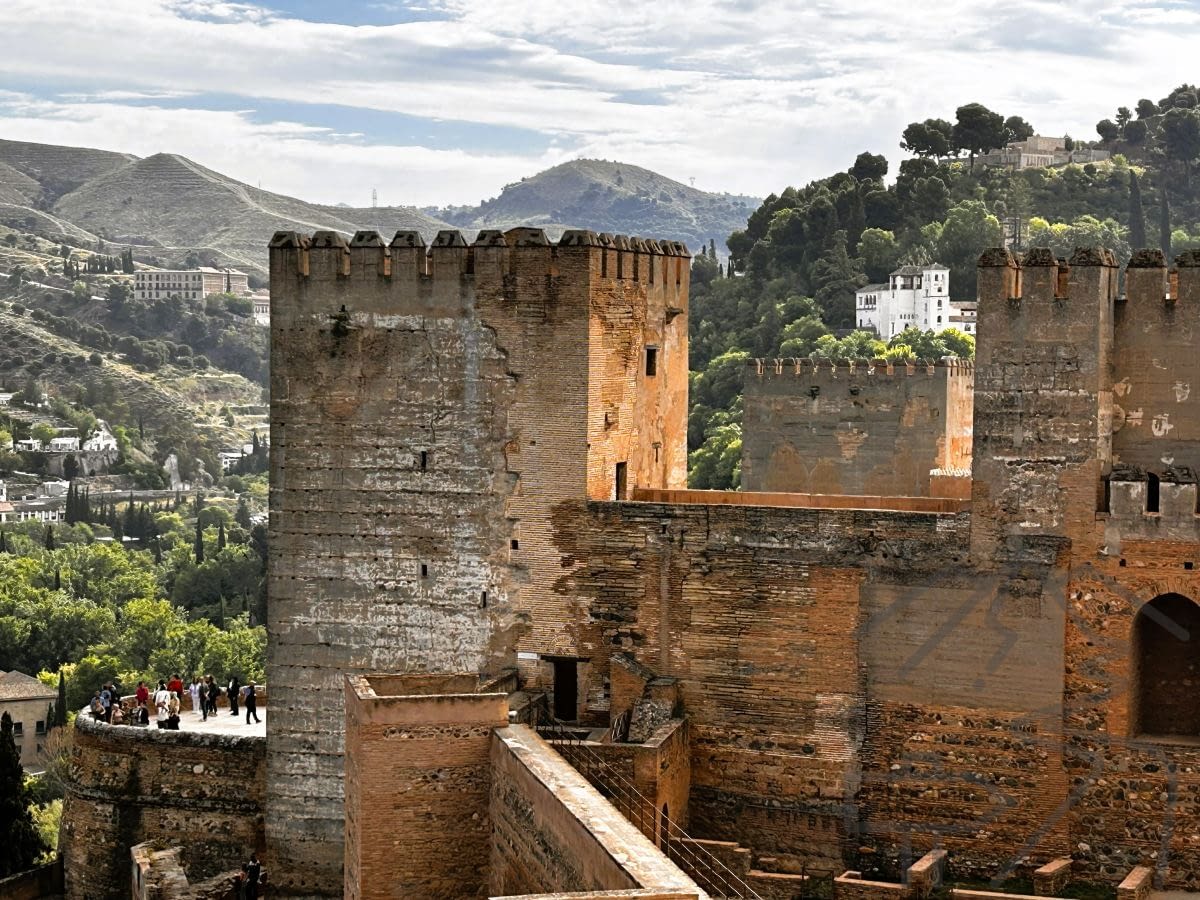 View from the Alcazaba in the Alhambra complex overlooking Granada and surrounding hills.