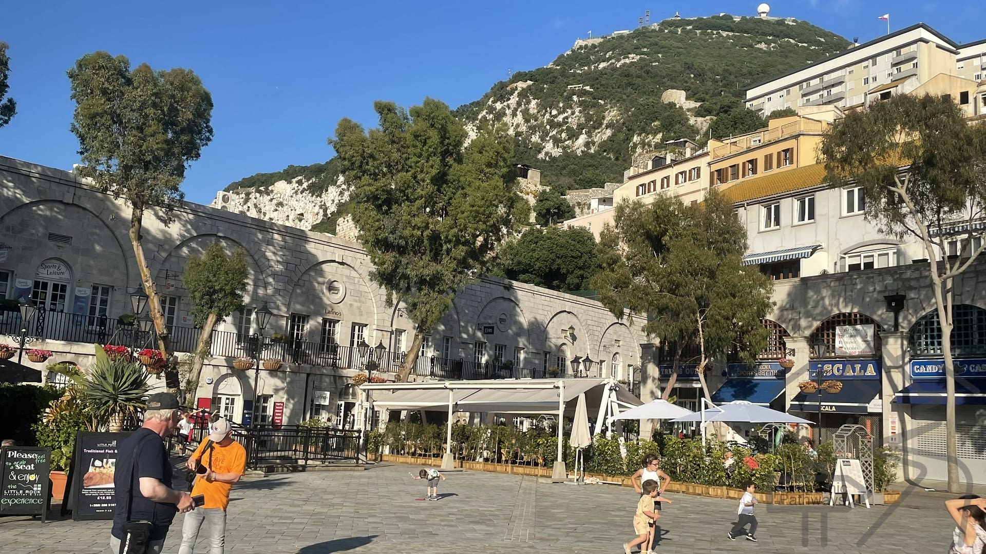 Grand Casemates Square in Gibraltar with outdoor caf&eacute;s and crowds